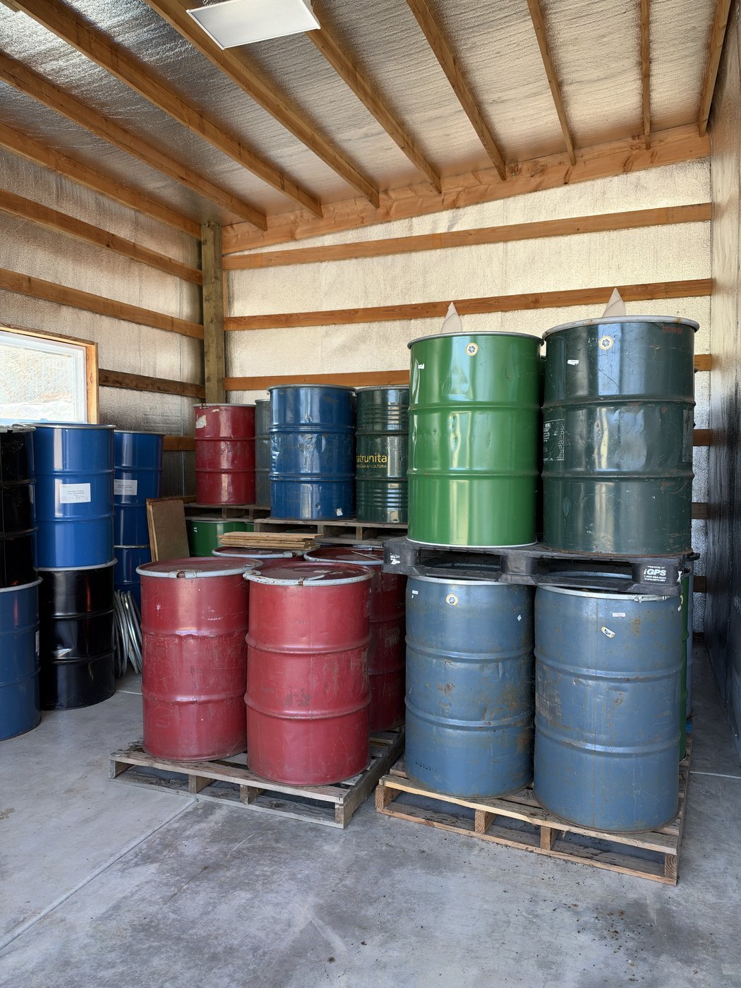 55-Gallon Steel Honey Drums Stored on Pallets in Damascus Warehouse